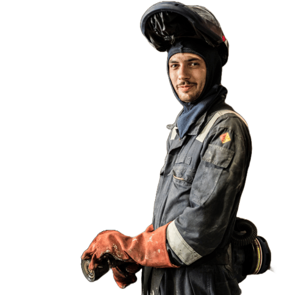 Element fire safety engineer in protective gear conducting building materials flammability testing