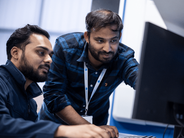 Element testing engineers reviewing test results at a computer