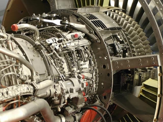 Technician performing aero engine testing to ensure safety and reliability.