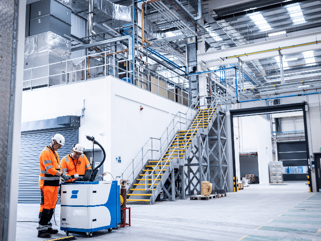 Emissions experts performing analysis of air