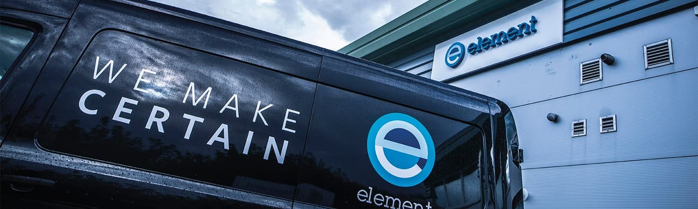 Element van labeled "We Make Certain" in front of Element environmental testing lab