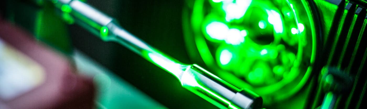 Advanced laser testing equipment with green light for precision materials analysis and inspection