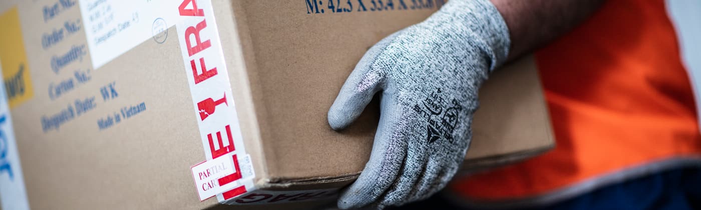 A worker carrying packages