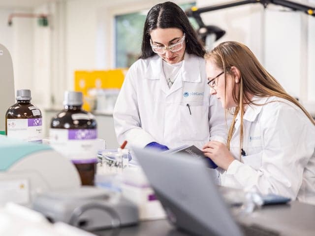 Element scientists discussing analytical testing protocols for pharmaceutical quality control