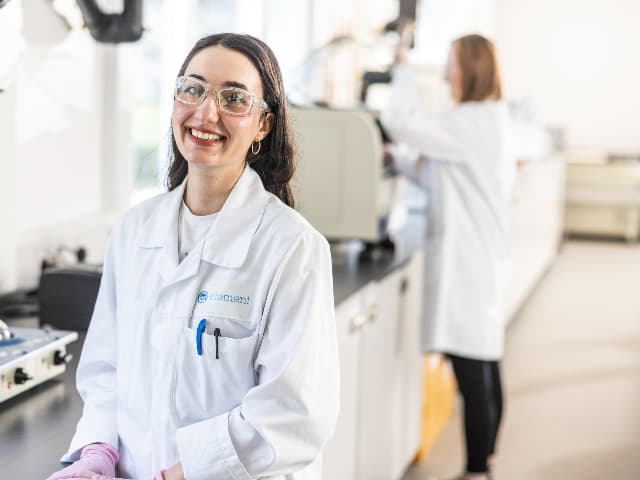 Element microbiologist performing rapid sterility testing in a biologics quality control laboratory