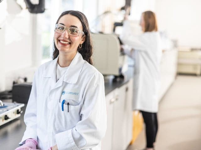 Element microbiologist performing rapid sterility testing in a biologics quality control laboratory