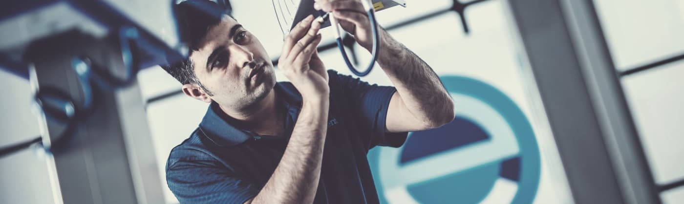 Engineer positioning a test antenna in an Element laboratory