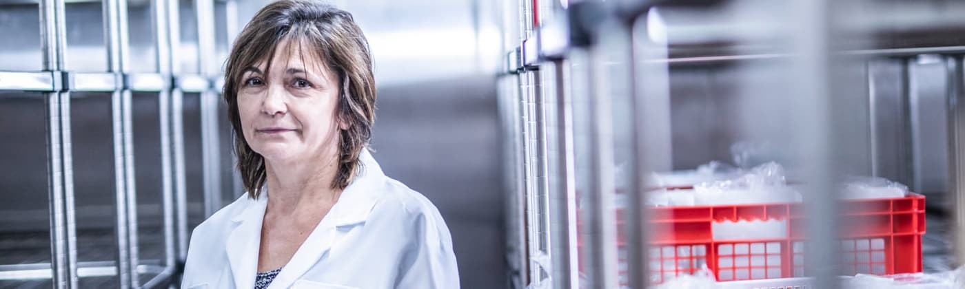 Element scientist in stability testing laboratory with temperature-controlled storage chambers and pharmaceutical samples