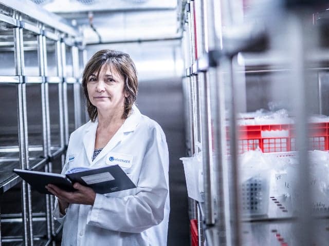 Pharmaceutical scientist in ICH-compliant stability storage chamber