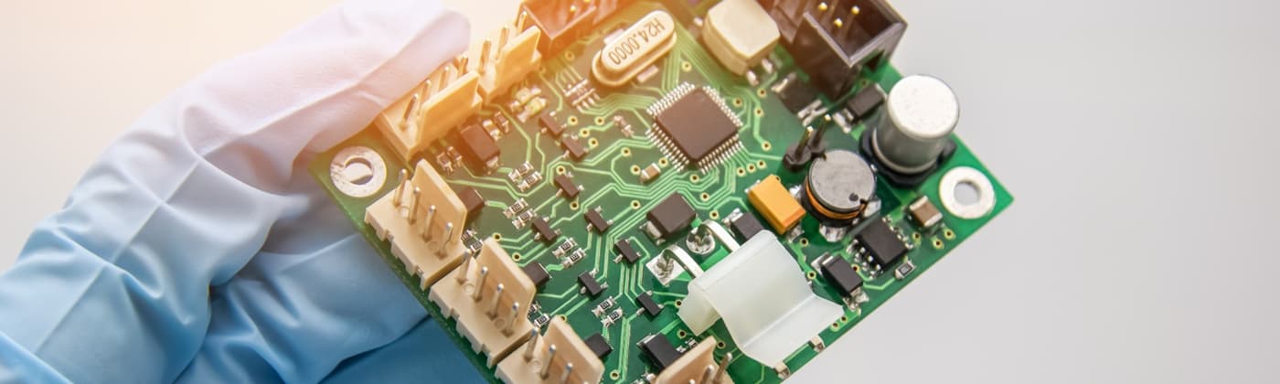 Hand holding pcb chip assembly