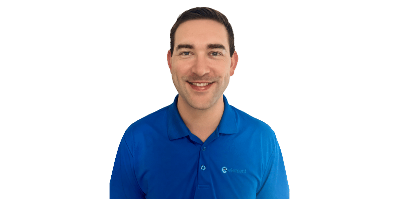Sam Humphrey, Business Development Associate at Element Des Moines, smiling in an Element-branded shirt