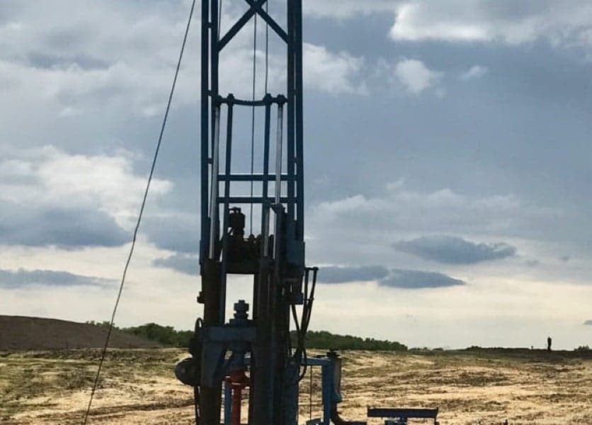 Geotechnical drilling rig conducting soil testing and foundation analysis at construction site