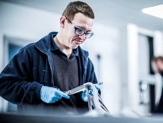 Engineer testing a sample of urethane foam