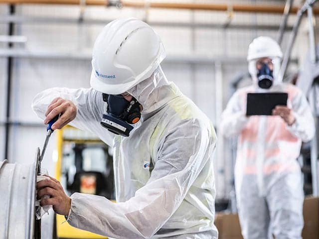 Worker undergoing face fit testing for respiratory protective equipment in industrial setting