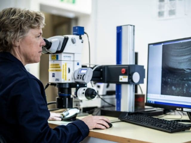 fiber reinforced composite materials using macroscopic and microscopic evaluation