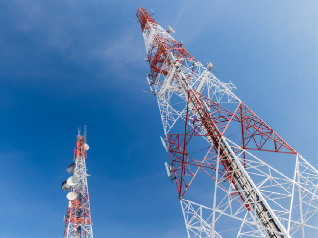 Telecommunications tower extending high above the landscape as it transmits data