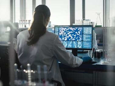 Scientist as a computer terminal looking at data