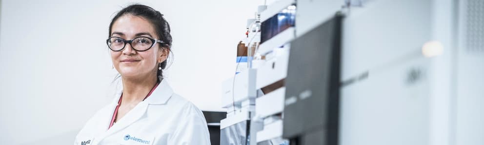 Element analytical chemist loading sample vials for nitrosamine NDSRI testing by liquid chromatography mass spectrometry